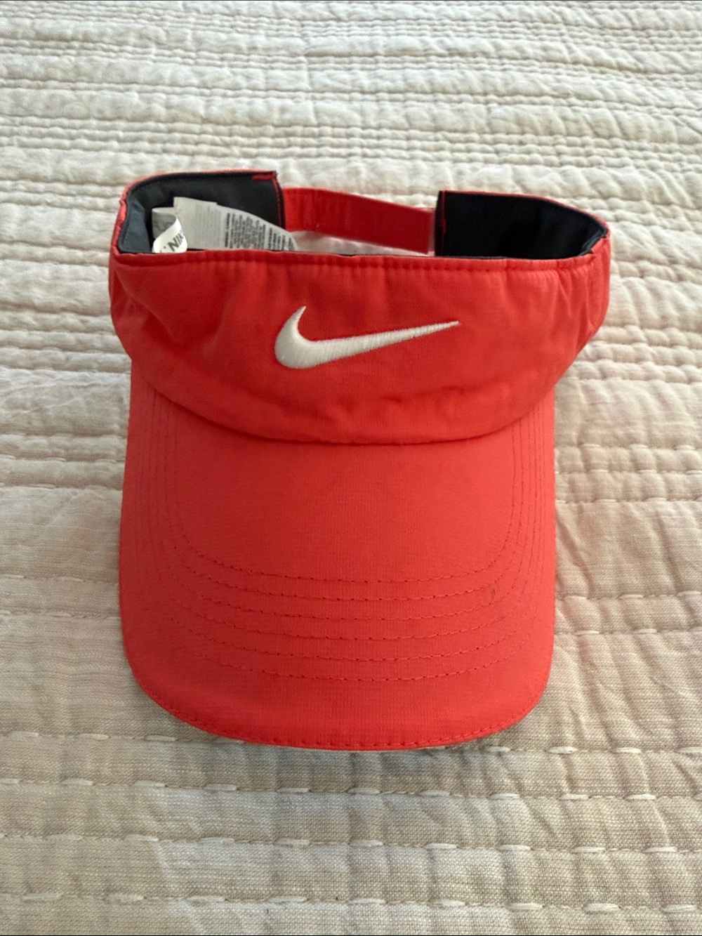 Nike women’s Coral-Red golf Visor with White Swoosh